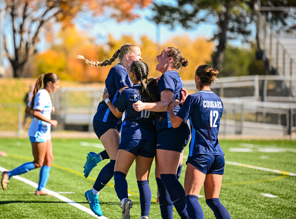 Players celebrating goal